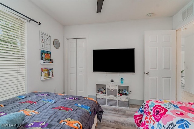 3430 35th Ave NE, Naples, FL 34120 - bedroom featuring wood finished floors, a closet, and ceiling fan