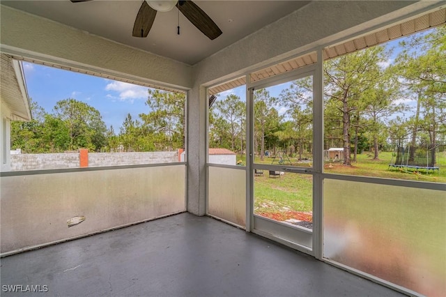 3430 35th Ave NE, Naples, FL 34120 - unfurnished sunroom featuring a ceiling fan