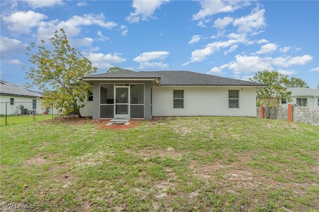 3430 35th Ave NE, Naples, FL 34120 - rear view of house with a sunroom, a fenced backyard, stucco siding, and ceiling fan