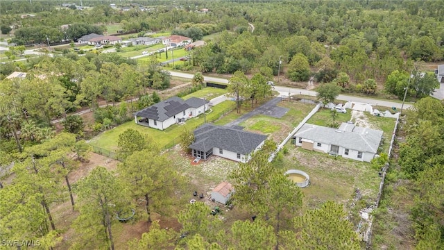 3430 35th Ave NE, Naples, FL 34120 - aerial overview of property's location with a forest and nearby suburban area