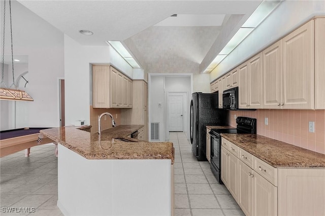 28480 Rochester Ct, Bonita Springs, FL 34135 - kitchen with black appliances, vaulted ceiling, backsplash, light tile patterned floors, and a peninsula