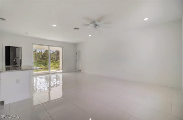 2109 Jefferson Ave, Alva, FL 33920 - unfurnished room featuring a ceiling fan, recessed lighting, and light tile patterned floors