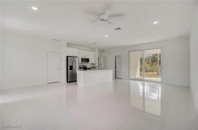 2109 Jefferson Ave, Alva, FL 33920 - unfurnished living room with a ceiling fan, light tile patterned flooring, and recessed lighting