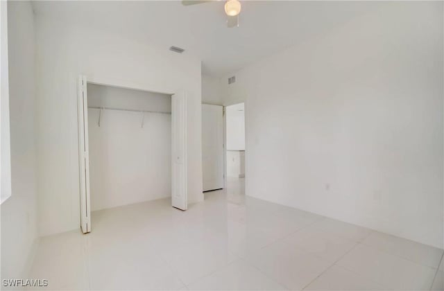 2109 Jefferson Ave, Alva, FL 33920 - unfurnished bedroom with a closet, ceiling fan, and light tile patterned flooring