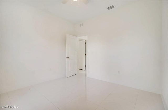 2109 Jefferson Ave, Alva, FL 33920 - spare room featuring light tile patterned floors and ceiling fan