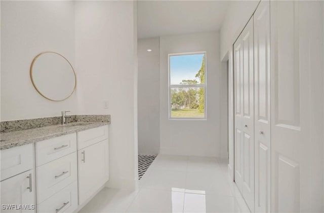 2109 Jefferson Ave, Alva, FL 33920 - bathroom featuring a closet, vanity, and tile patterned flooring