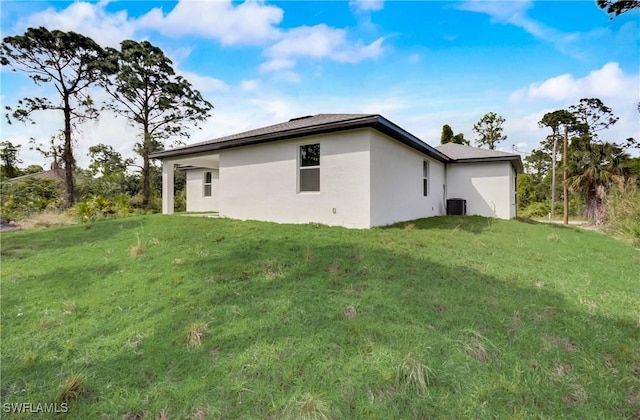 2109 Jefferson Ave, Alva, FL 33920 - view of home's exterior featuring stucco siding and a lawn