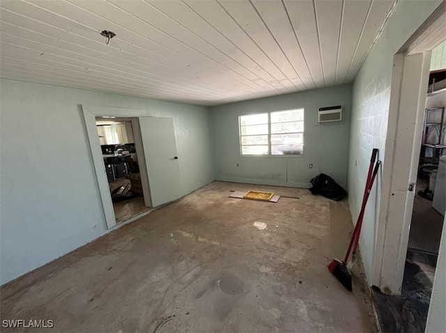 1262 Joerin Ave, North Fort Myers, FL 33903 - unfurnished room featuring unfinished concrete floors, a wall mounted AC, and wood ceiling