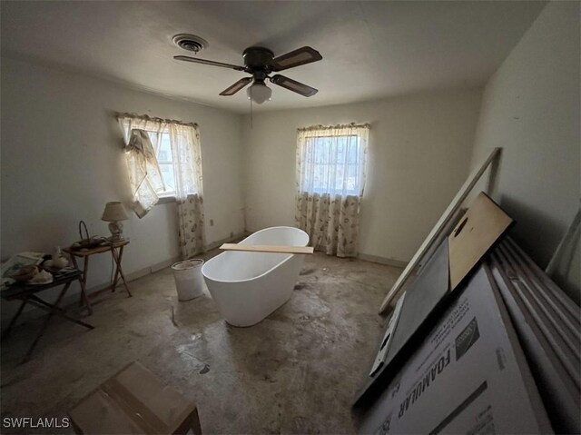 1262 Joerin Ave, North Fort Myers, FL 33903 - bedroom featuring unfinished concrete floors and a ceiling fan