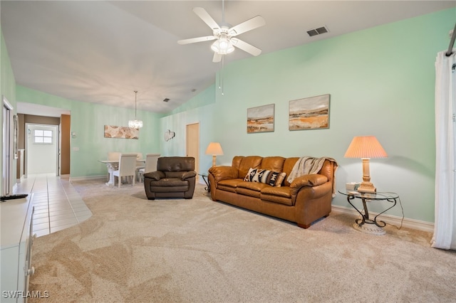 15041 Lakeside View Dr Unit 2104, Fort Myers, FL 33919 - living room featuring vaulted ceiling, carpet, a chandelier, ceiling fan, and tile patterned flooring