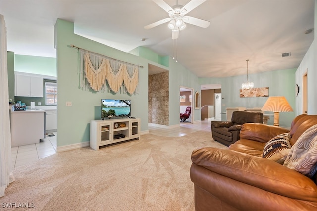 15041 Lakeside View Dr Unit 2104, Fort Myers, FL 33919 - living room featuring light tile patterned floors, vaulted ceiling, ceiling fan, a chandelier, and light colored carpet
