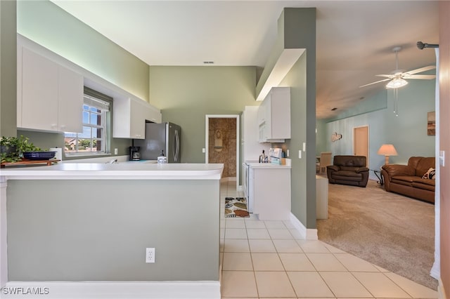 15041 Lakeside View Dr Unit 2104, Fort Myers, FL 33919 - kitchen featuring freestanding refrigerator, light tile patterned floors, light carpet, light countertops, and a peninsula
