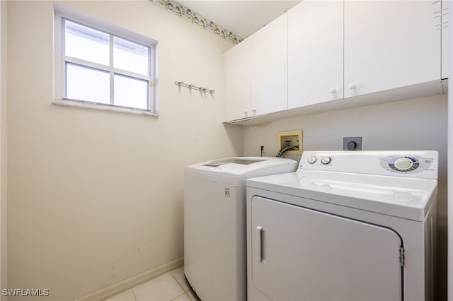 15041 Lakeside View Dr Unit 2104, Fort Myers, FL 33919 - laundry area featuring cabinet space, washing machine and dryer, and light tile patterned flooring