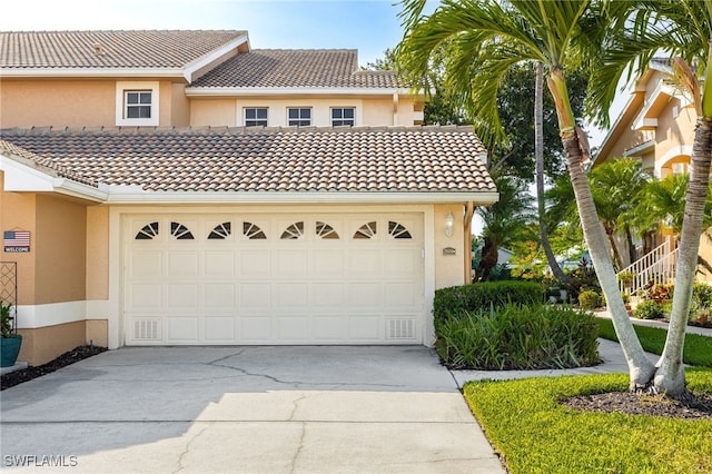 15041 Lakeside View Dr Unit 2104, Fort Myers, FL 33919 - view of front of house featuring stucco siding and concrete driveway