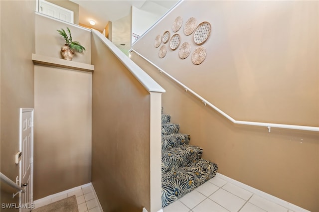 15041 Lakeside View Dr Unit 2104, Fort Myers, FL 33919 - staircase with tile patterned floors and baseboards