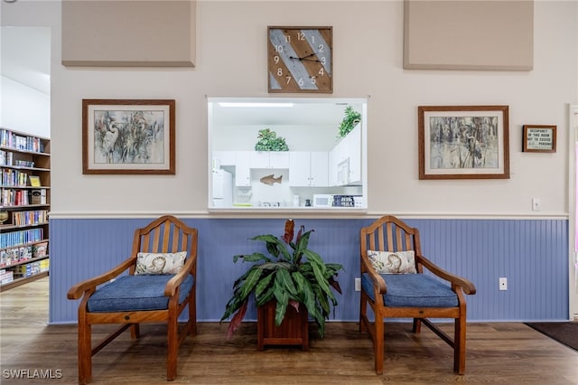 15041 Lakeside View Dr Unit 2104, Fort Myers, FL 33919 - sitting room featuring wainscoting and wood finished floors