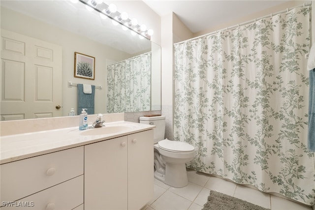 15041 Lakeside View Dr Unit 2104, Fort Myers, FL 33919 - bathroom with tile patterned floors, vanity, tile walls, a shower with shower curtain, and wainscoting