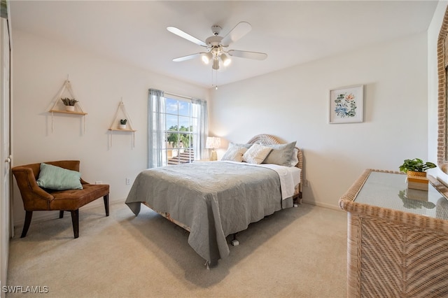 15041 Lakeside View Dr Unit 2104, Fort Myers, FL 33919 - bedroom with light colored carpet and a ceiling fan