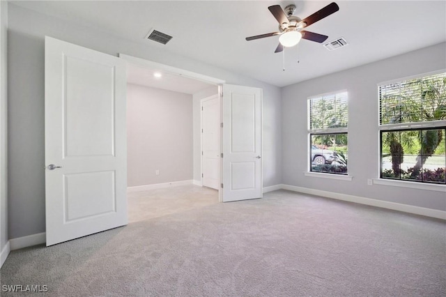 17215 Hadlow Pl, Fort Myers, FL 33967 - unfurnished bedroom with light carpet and ceiling fan