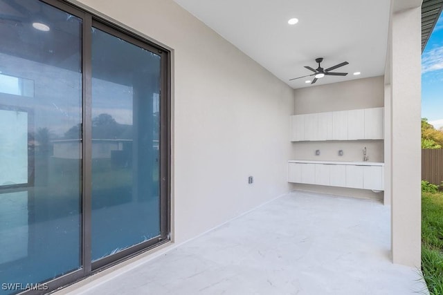 3209 22nd St SW, Lehigh Acres, FL 33976 - view of patio / terrace featuring a ceiling fan and a sink