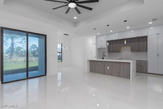 3209 22nd St SW, Lehigh Acres, FL 33976 - kitchen featuring modern cabinets, a ceiling fan, white cabinetry, and recessed lighting