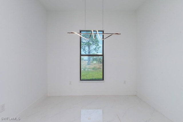 3209 22nd St SW, Lehigh Acres, FL 33976 - unfurnished room featuring marble look tile flooring and baseboards