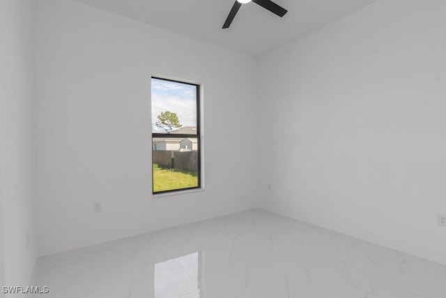 3209 22nd St SW, Lehigh Acres, FL 33976 - empty room featuring marble tiled flooring and ceiling fan