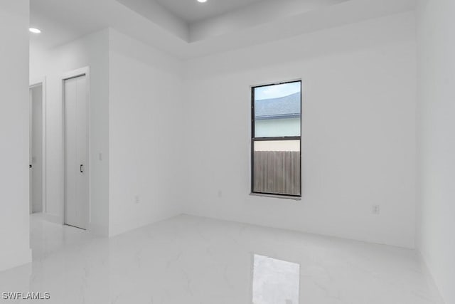 3209 22nd St SW, Lehigh Acres, FL 33976 - spare room with marble tiled flooring and recessed lighting