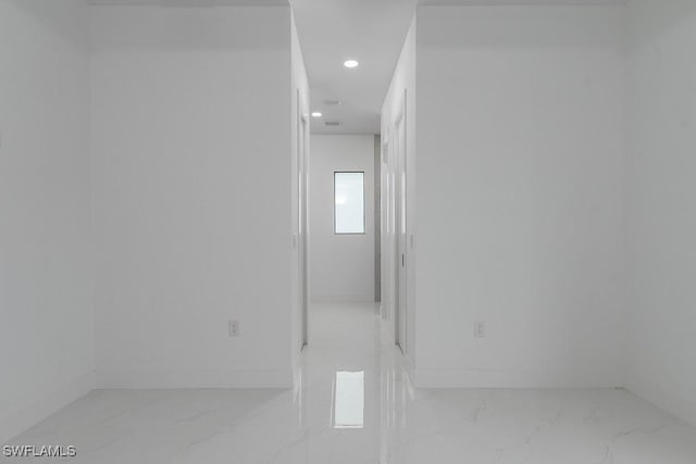 3209 22nd St SW, Lehigh Acres, FL 33976 - corridor with light marble finish floors and recessed lighting