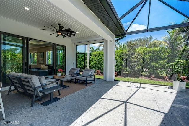 234 Legacy Ct, Naples, FL 34110 - view of patio with ceiling fan, an outdoor living space, and glass enclosure