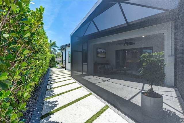 234 Legacy Ct, Naples, FL 34110 - back of property featuring a patio area, ceiling fan, a lanai, and stucco siding