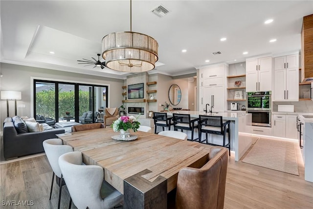 234 Legacy Ct, Naples, FL 34110 - dining space featuring recessed lighting, ornamental molding, and light wood-type flooring