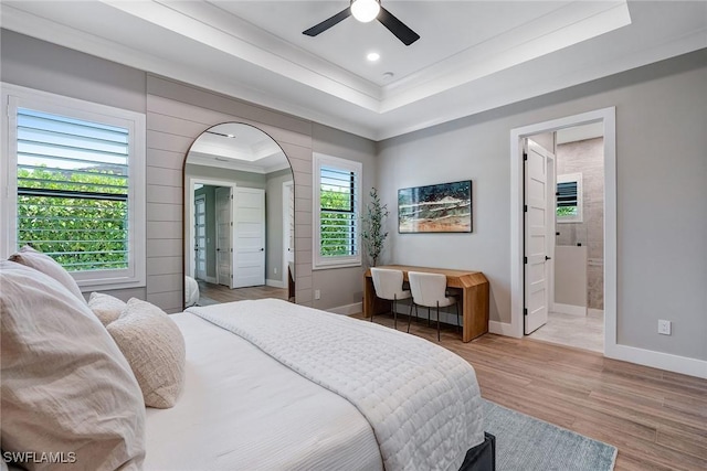 234 Legacy Ct, Naples, FL 34110 - bedroom with a raised ceiling, ornamental molding, wood finished floors, arched walkways, and recessed lighting