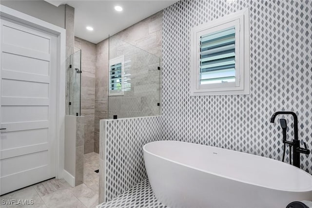 234 Legacy Ct, Naples, FL 34110 - full bathroom with a soaking tub, walk in shower, plenty of natural light, and recessed lighting