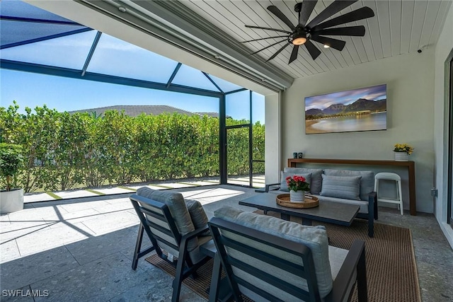 234 Legacy Ct, Naples, FL 34110 - view of patio featuring ceiling fan, glass enclosure, and an outdoor hangout area
