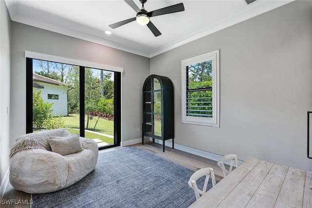 234 Legacy Ct, Naples, FL 34110 - living area featuring wood finished floors, ceiling fan, ornamental molding, and recessed lighting
