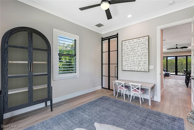 234 Legacy Ct, Naples, FL 34110 - living area with ceiling fan, wood finished floors, and crown molding