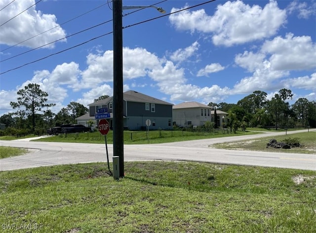 200 W 17th St, Lehigh Acres, FL 33972 - view of asphalt road with traffic signs