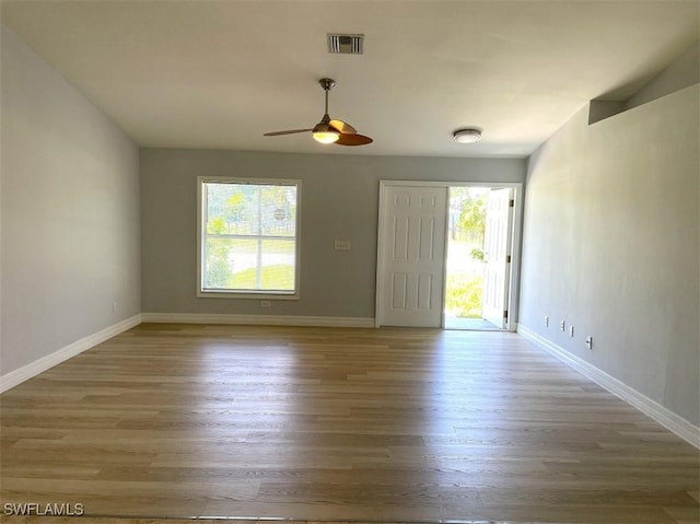 200 W 17th St, Lehigh Acres, FL 33972 - empty room with wood finished floors and a ceiling fan