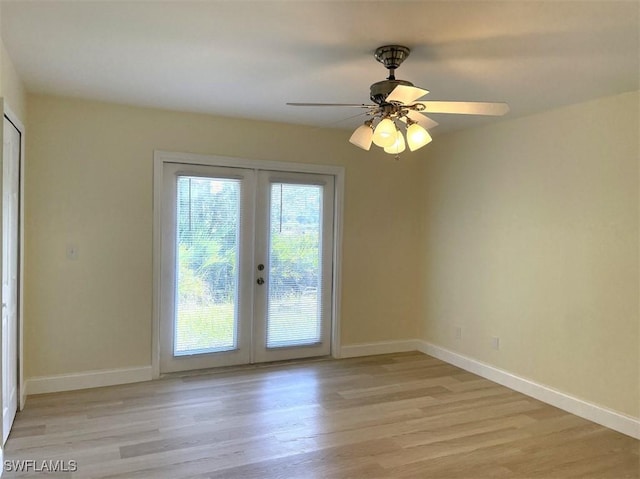 200 W 17th St, Lehigh Acres, FL 33972 - spare room with french doors and light wood-style flooring