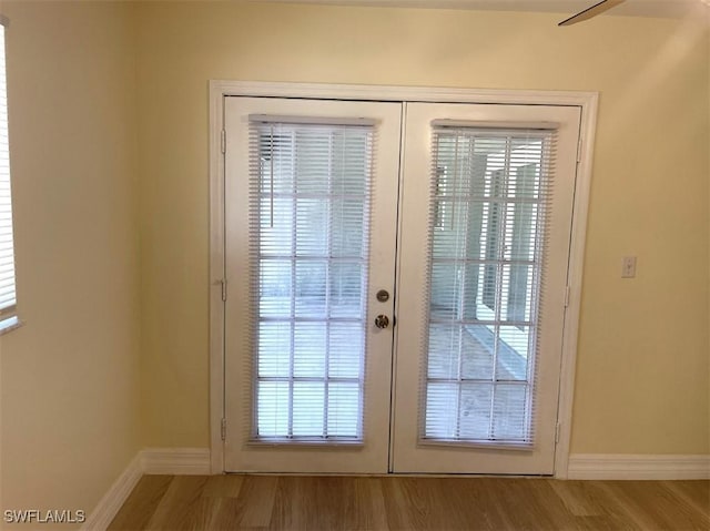 200 W 17th St, Lehigh Acres, FL 33972 - doorway with french doors and wood finished floors