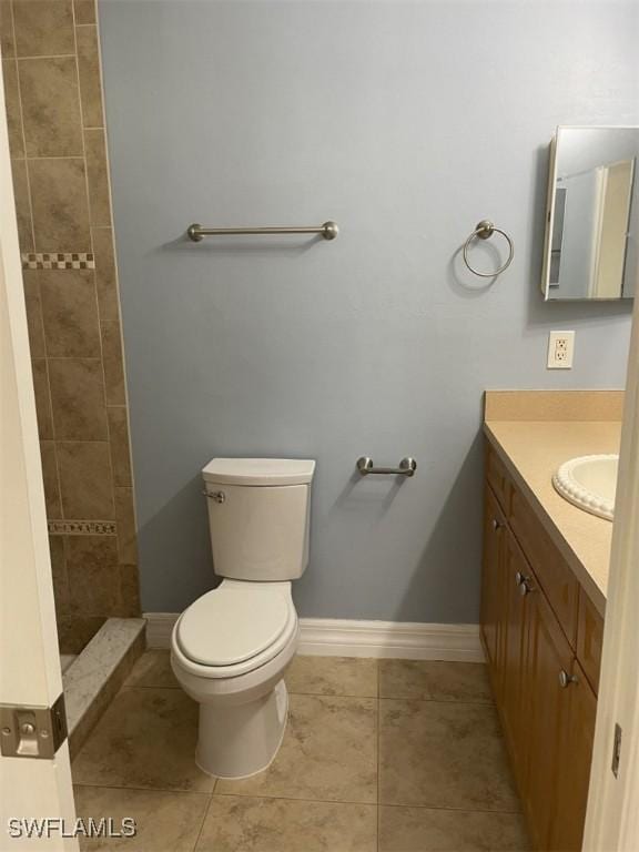 200 W 17th St, Lehigh Acres, FL 33972 - full bathroom featuring vanity, tile patterned floors, and a tile shower