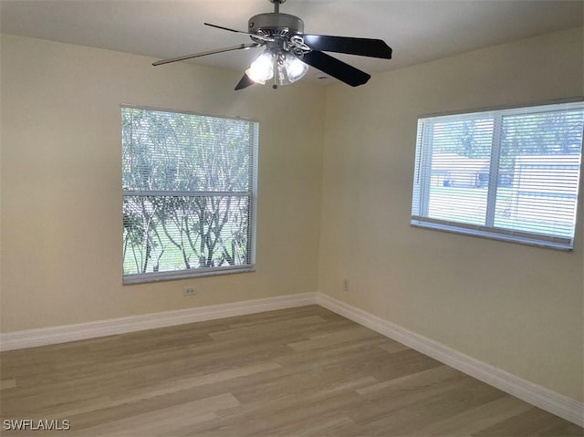 200 W 17th St, Lehigh Acres, FL 33972 - spare room with wood finished floors and ceiling fan
