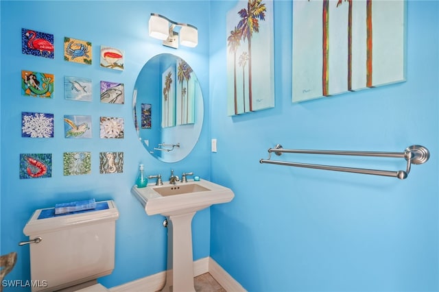 5251 Westminster Dr, Fort Myers, FL 33919 - bathroom featuring toilet and baseboards