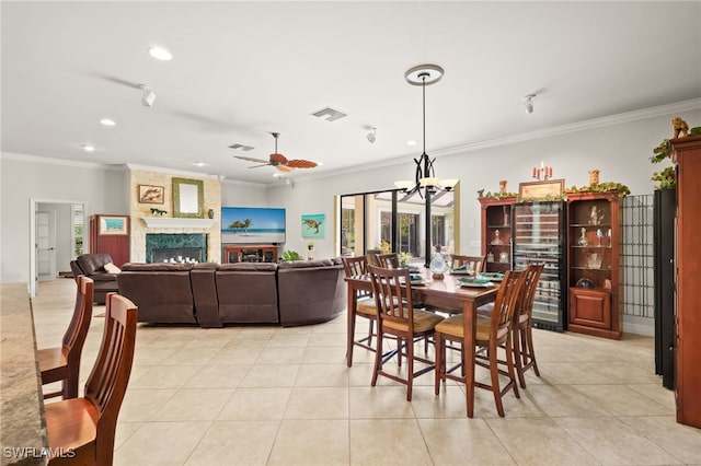 5251 Westminster Dr, Fort Myers, FL 33919 - dining area with recessed lighting, light tile patterned floors, wine cooler, crown molding, and a ceiling fan