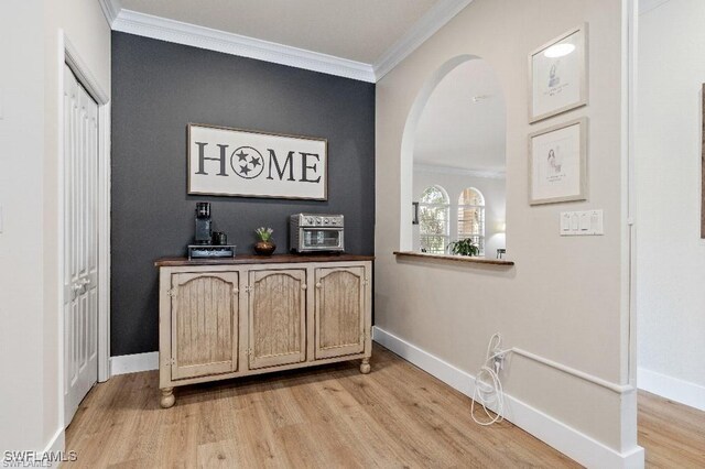12455 Muddy Creek Ln, Fort Myers, FL 33913 - detailed view of crown molding, wood finished floors, and arched walkways