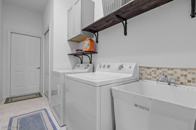 12455 Muddy Creek Ln, Fort Myers, FL 33913 - washroom featuring cabinet space, separate washer and dryer, and light tile patterned floors