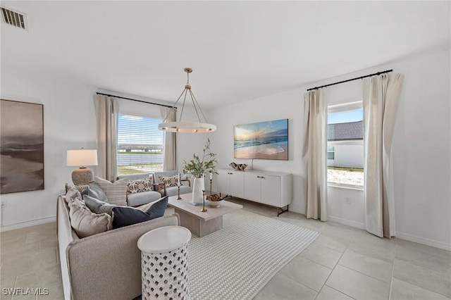 17251 Monte Isola Way N, Fort Myers, FL 33917 - living room with light tile patterned floors and a water view