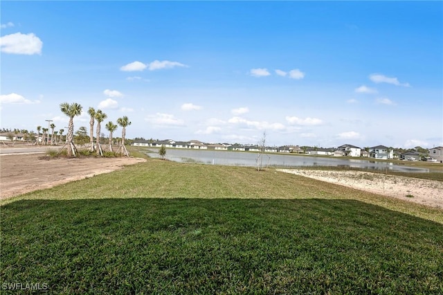 17251 Monte Isola Way N, Fort Myers, FL 33917 - view of green lawn featuring a water view and a residential view