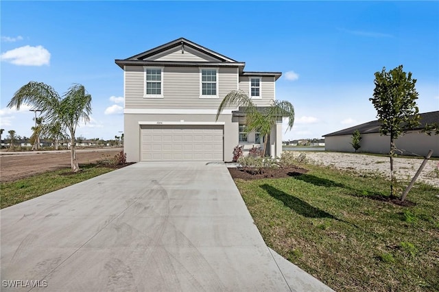 17251 Monte Isola Way N, Fort Myers, FL 33917 - view of front facade with concrete driveway, a garage, a front yard, and stucco siding